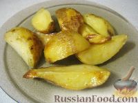 Фото к рецепту: Запеченный картофель с чесноком