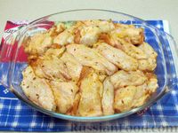 Фото приготовления рецепта: Куриные крылышки, запечённые с рисом - шаг №13