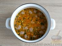 Фото приготовления рецепта: Суп с фрикадельками, рисом и грецкими орехами - шаг №17