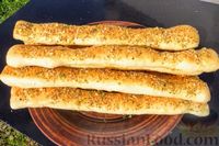 Фото к рецепту: Cырно-чесночные хлебные палочки
