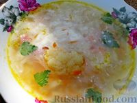 Фото приготовления рецепта: Суп с цветной капустой, рисом и копчёными колбасками - шаг №12
