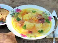 Фото к рецепту: Суп с цветной капустой, рисом и копчёными колбасками