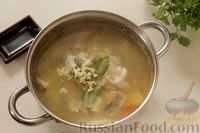 Фото приготовления рецепта: Рыбный суп с рисом - шаг №10