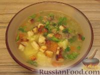 Фото к рецепту: Густой куриный суп с чесночными сухариками