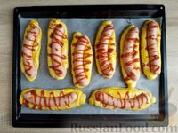 Фото приготовления рецепта: Сосиски в тесте по-новому, с кетчупом и сыром - шаг №21