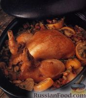 Фото к рецепту: Курица, тушенная с фасолью в духовке