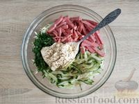 Фото приготовления рецепта: Салат из капусты с колбасой и огурцами - шаг №8