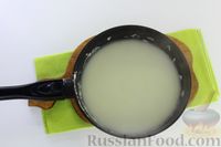 Фото приготовления рецепта: Цветная капуста, запечённая в кефирном соусе с чесноком - шаг №7