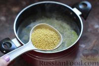 Фото приготовления рецепта: Суп с килькой в томатном соусе, пшеном и яйцами - шаг №6