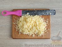 Фото приготовления рецепта: Отбивные из индейки, запечённые с помидорами и сыром - шаг №9