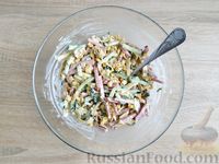 Фото приготовления рецепта: Салат с колбасой, огурцами, кукурузой и яичными блинчиками - шаг №12