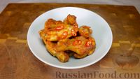 Фото приготовления рецепта: Запечёные куриные крылья в духовке - шаг №6