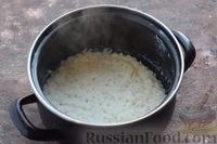 Фото приготовления рецепта: Сладкая рисовая запеканка с яблоками, морковью и изюмом - шаг №2