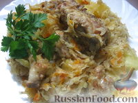 Фото к рецепту: Тушеная капуста с мясом и картофелем