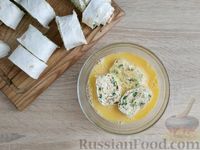 Фото приготовления рецепта: Рулетики из лаваша с сыром, зеленью и яйцами, на сковороде - шаг №16