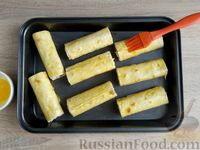 Фото приготовления рецепта: Трубочки из лаваша с варёными яйцами, сыром и зелёным луком (в духовке) - шаг №15