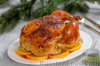 Фото к рецепту: Курица, запечённая с апельсинами