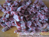 Фото приготовления рецепта: Капуста, тушенная с фаршем и грибами - шаг №7