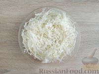 Фото приготовления рецепта: Капуста, тушенная с картошкой и сосисками - шаг №8
