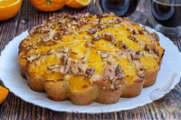 Фото приготовления рецепта: Постный апельсиновый пирог с изюмом и орехами, на соке и растительном масле - шаг №16