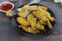 Фото к рецепту: Запечённое куриное филе в сырной панировке (наггетсы)