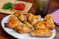 Фото к рецепту: Жареные куриные крылышки в кисло-сладком соусе