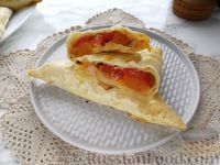 Фото приготовления рецепта: Пирожки из лаваша с тыквой, бужениной и сыром (в духовке) - шаг №22