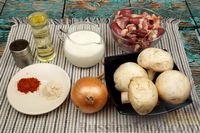 Фото приготовления рецепта: Куриные сердечки, тушенные  с грибами в сливочном соусе - шаг №1