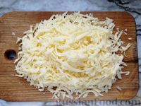 Фото приготовления рецепта: Куриное филе с грибами, запечённое в сметанно-сырном соусе - шаг №8
