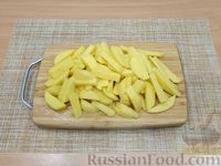 Фото приготовления рецепта: Картошка с тушёнкой и солёными огурцами - шаг №9