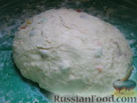 Фото приготовления рецепта: Пасхальный кулич с цукатами и изюмом - шаг №11