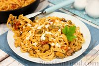 Фото к рецепту: Спагетти с морепродуктами в сливочно-томатном соусе