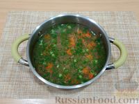 Фото приготовления рецепта: Рыбный суп из минтая с овощами - шаг №12