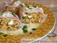 Фото к рецепту: Кальмары, фаршированные рисом, луком и яйцом