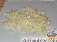 Фото приготовления рецепта: Кальмары, фаршированные рисом, луком и яйцом - шаг №3