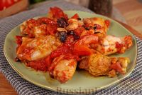Фото к рецепту: Куриные крылышки, запечённые в томатном соусе, с изюмом и миндалём