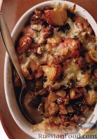 Фото к рецепту: Картофель, запеченный с мясом, грибами и сыром