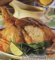 Фото к рецепту: Жареная курица, фаршированная орехами