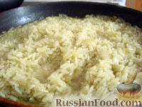 Фото к рецепту: Рис тушеный с луком и специями