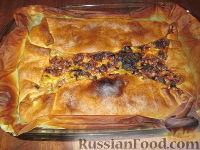 Фото к рецепту: Открытый пирог с луком-пореем