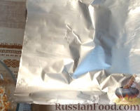 Фото приготовления рецепта: Скумбрия фаршированная, варенная в пакете - шаг №9